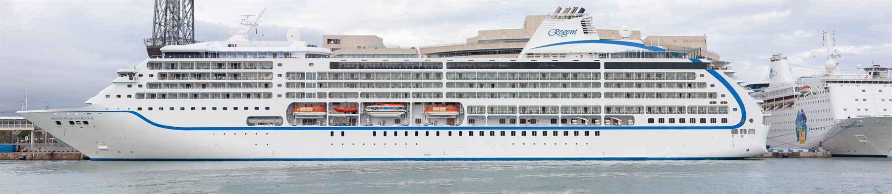 A Regent Seven Seas cruise ship docked in port